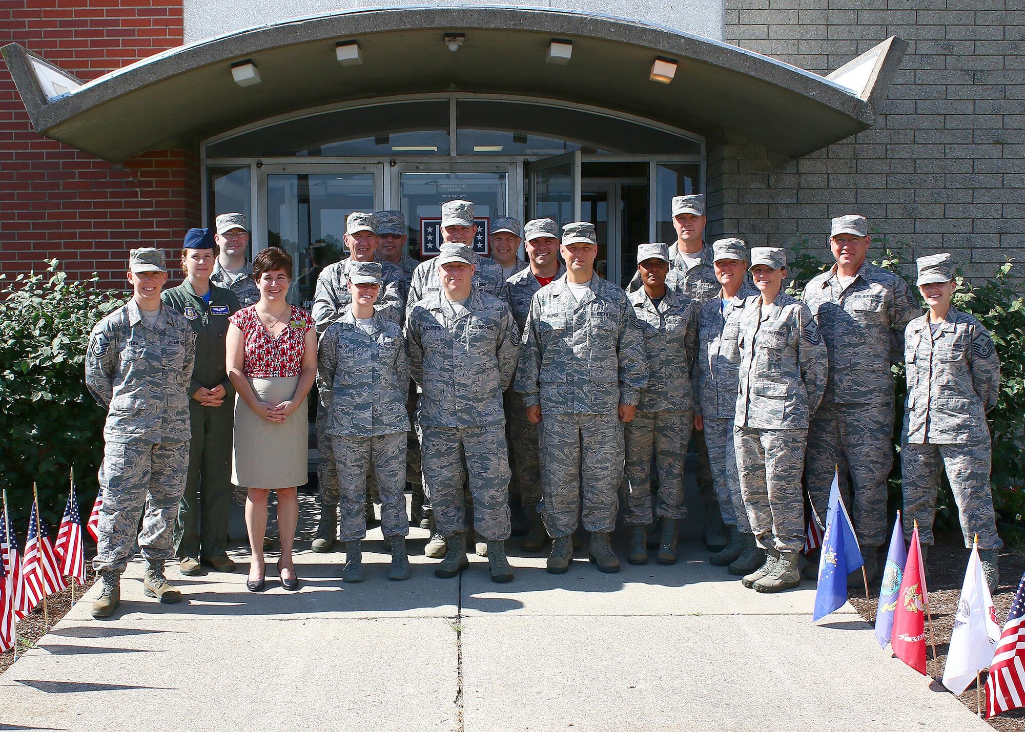 Members of the 445th Airlift Wing First Sergeants Council pose with Sharon Christy, center manager of the Wright-Patterson Air Force Base United Service Organizations (USO) here, in front of the USO facility located in the Kittyhawk area. The USO is available to all branches of the military, guard and reserves, spouses, and family members, July 16, 2016, 2016. (U.S. Air Force photo/Tech. Sgt. Patrick O’Reilly)