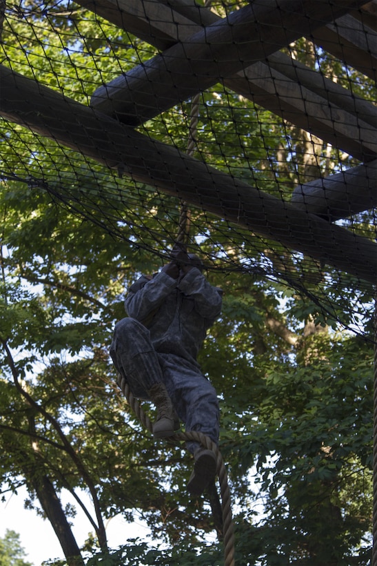 Task Force Wolf instructor, Army Reserve Sgt. 1st Class Harry Bowles from the 2nd of the 399th Training Support Battalion (ROTC), demonstrates the correct way to master The Tough One for the Cadet Initial Entry Training (CIET) candidates on the confidence course during U.S. Army ROTC Cadet Summer Training (CST16), at Ft Knox, Ky., June 8. (U.S. Army Reserve photo by Sgt. Karen Sampson/ Released).