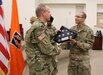Col. (Promotable) John H. Phillips, commander, 451st Sustainment Command (Expeditionary) (left), presents an American flag in a display case to 1st Lt. Anthony Rodriguez, a network operations officer and native of Tampa, Florida assigned to Detachment 11, 335th Signal Command (Theater), during a Welcome Home Warrior Ceremony at North Fort Hood, Texas Aug. 3.  The detachment of 24 Soldiers spent the last nine months deployed to Afghanistan in support of Operation Enduring Freedom and the ongoing war on terrorism.   Their mission comprised of providing, maintaining, repairing and establishing electronic communications throughout the Afghan theater of operations.