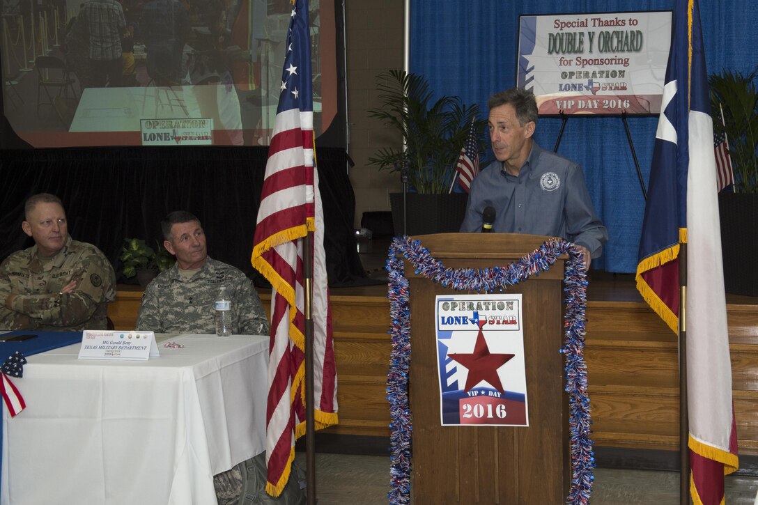 David Gruber, Department of State Health Services (DSHS), addresses the audience during the Operation Lone Star (OLS) VIP event in Brownsville, Texas, July 28, 2016. Service members from the Texas State Guard worked alongside Soldiers from the 804th Medical Brigade, U.S. Army Reserves, the Texas Department of Public Safety, DSHS, Remote Area Medical volunteers, Cameron County Department of Health and Human Services (DHHS), City of Laredo Health Department, Hidalgo County DHHS and U.S. Public Health Services during OLS, a week long real-time, large-scale emergency preparedness exercise in La Joya, Pharr, Brownsville, Rio Grande City and Laredo, Texas, July 25-29, 2016. OLS is an annual medical disaster preparedness training exercise, uniting federal, state and local health and human service providers, that addresses the medical needs of thousands of underserved Texas residents every year. (U.S. Army National Guard photo by Capt. Martha Nigrelle)
