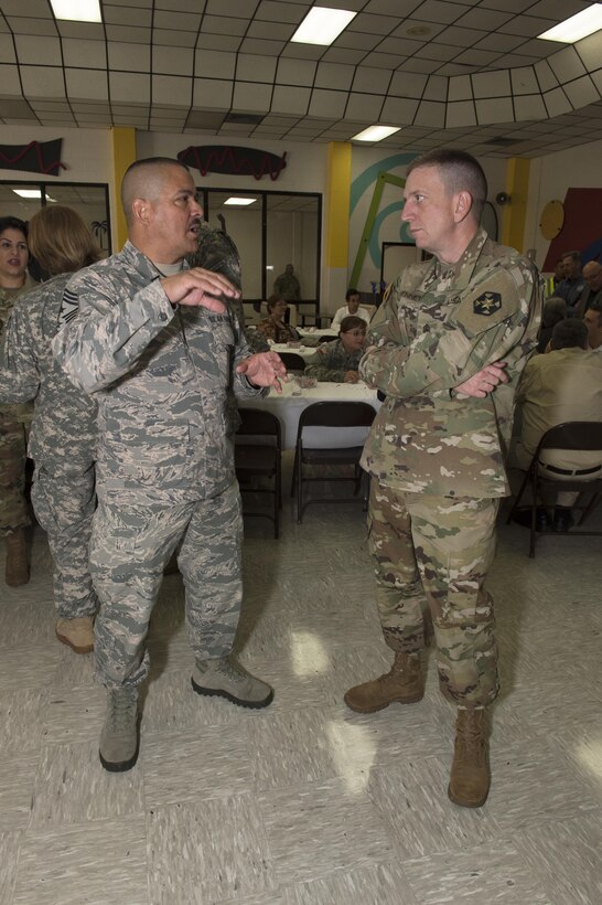 Chief Master Sgt. Oscar Tey, Senior Enlisted Leader for the Domestic Operations Task Force, Texas Military Department, left and Command Sgt. Maj. Robert Bennet, 804th Medical Brigade command sergeant major, U.S. Army Reserves discuss operations at the Operation Lone Star VIP event, July 28, 2016 in Brownsville, Texas. Service members from the Texas State Guard worked alongside Soldiers from the 804th Medical Brigade, U.S. Army Reserves, the Texas Department of Public Safety, the Department of State Health Services, Remote Area Medical volunteers, Cameron County Department of Human Health Services (DHHS), City of Laredo Health Department, Hidalgo County DHHS and U.S. Public Health Services during Operation Lone Star (OLS), a week long real-time, large-scale emergency preparedness exercise in La Joya, Pharr, Brownsville, Rio Grande City and Laredo, Texas, July 25-29, 2016. OLS is an annual medical disaster preparedness training exercise, uniting federal, state and local health and human service providers, that addresses the medical needs of thousands of underserved Texas residents every year. (U.S. Army National Guard photo by Capt. Martha Nigrelle)