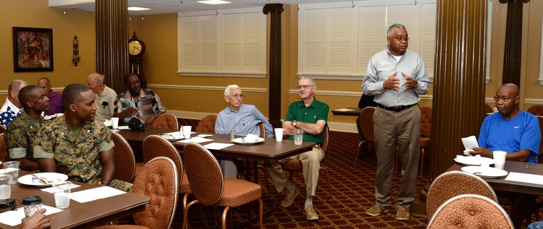 Raymond Breaux, retired affairs officer, Marine Corps Community Services, Marine Corps Logistics Base Albany, welcomes roughly two dozen veterans to the installation’s Veterans Breakfast, Aug. 3. The monthly event was held at Marine Corps Logistics Base Albany’s Town & Country Restaurant Grand Ballroom.