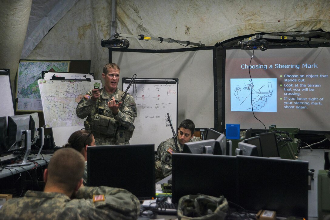 Army Capt. Micah Kidney teaches a land navigation class to soldiers during Vigilant Guard 2016 at Camp Ethan Allen Training Site, Jericho, Vt., July 28, 2016. Kidney is commander, Vermont National Guard’s Headquarters Company, 86th Infantry Brigade Combat Team (Mountain). The National Guard and U.S. Northern Command sponsor the emergency response exercise, which provides an opportunity for service members to improve cooperation with civilian, military and federal partners as they prepare for emergencies and catastrophic events. Air National Guard photo by Airman 1st Class Jeffrey Tatro