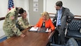 Sgt. 1st Class Princess Gibbs, executive assistant with Office of the Assistant Secretary of the Army Acquisition, Logistics & Technology and Lt. Col. Jason Reherman, Department of the Army systems coordinator assigned to ASA (ALT) Army Reserve Element work together with Ms. Christy Carlile, staff action specialist and Mr. Bryon Manna, congressional analyst both for ASA (ALT). The group was tasked to take a closer look at the three principal decision making support systems within the Department of Defense (DoD) in order to make the process faster and better. 