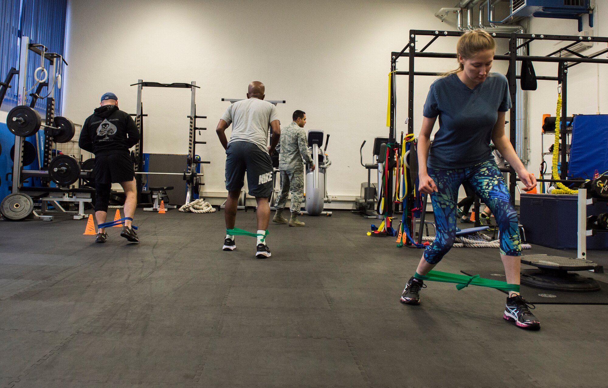 Ramstein Airmen perform exercises during a knee rehabilitation class at Ramstein Air Base, Germany, Aug. 2, 2016. The 86th Medical Operations Squadron physical therapy technicians instruct knee and back rehabilitation classes to assist with patrons’ recovery from chronic or acute injuries in order to return to their duties as soon as possible. (U.S. Air Force photo/ Senior Airman Nesha Humes)