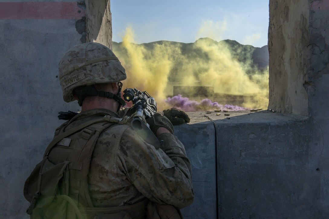 Marine Corps Air Ground Combat Center at Twentynine Palms, California – A Marine with Kilo Company, 3rd Battalion, 5th Marine Regiment runs through a scenario during the Marine Air Ground Task Force Integrated Experiment (MIX-16) August 5, 2016 at the Marine Corps Air Ground Combat Center at Twentynine Palms, California. MIX-16 is being used to test new equipment and concepts to help the Marine Corps meet the challenges of the future operating environment. MIX=16 is the first event in the Sea Dragon 2025 initiative, which is the Marine Corps’ deliberate campaign to blend innovative ideas and concepts through war gaming and experimentation to refine the force of the future. 