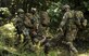 Explosive ordnance disposal (EOD) team members with the 509th Civil Engineer Squadron perform a medical evacuation during the Operation Thunder Weasel exercise at the Truman Lake National Guard Training Site, Mo., July 27, 2016. The EOD team was tested on their ability to treat a patient and evacuate them to a helicopter landing zone. (U.S. Air Force photo by Senior Airman Danielle Quilla)