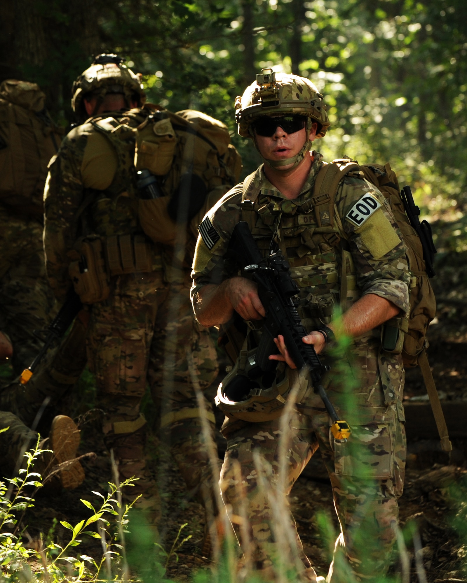 U.S. Air Force Airman 1st Class Nicholas Wake, an explosive ordnance disposal team member assigned to the 509th Civil Engineer Squadron, provides rear security during the Operation Thunder Weasel exercise at the Truman Lake National Guard Training Site, Mo., July 27, 2016. His security actions ensured his remaining team members were able to safely evacuate the casualty during an ambush scenario. (U.S. Air Force photo by Senior Airman Danielle Quilla)