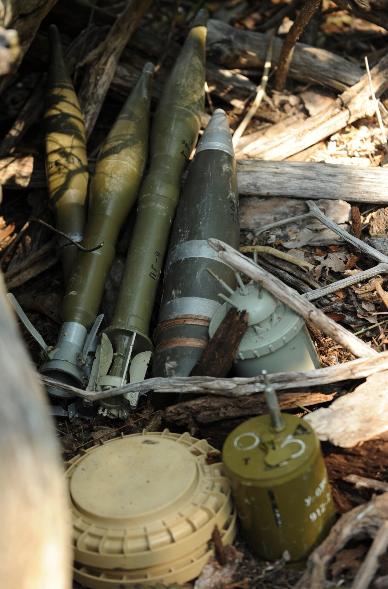 Unexploded ordnance items are hidden during the Operation Thunder Weasel exercise at the Truman Lake National Guard Training Site, Mo., July 27, 2016. Explosive ordnance disposal team members were tasked to locate, identify and dispose of the unexploded ordnance in support of their mission. (U.S. Air Force photo by Senior Airman Danielle Quilla)