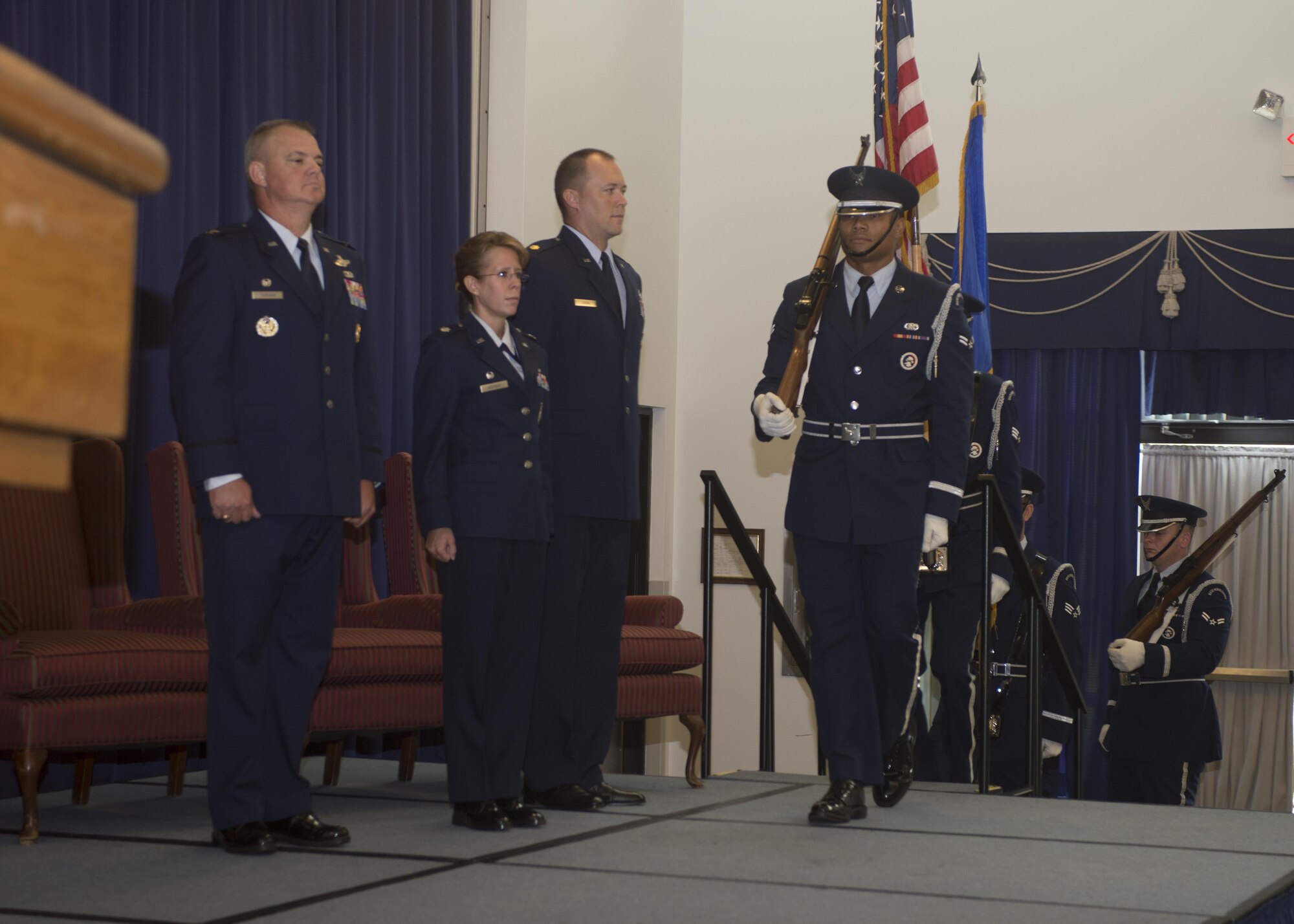 Honor Guard members from the 512th Airlift Wing present the colors to open a change of command ceremony for the 512th Security Forces Squadron at Dover Air Force Base, Del., Aug. 6, 2016. Lt. Col. Jennifer Aquinas relinquished command of the 512th SFS to Maj. Alexander Logan. (U.S. Air Force Photo/ Tech. Sgt. Nathan Rivard)