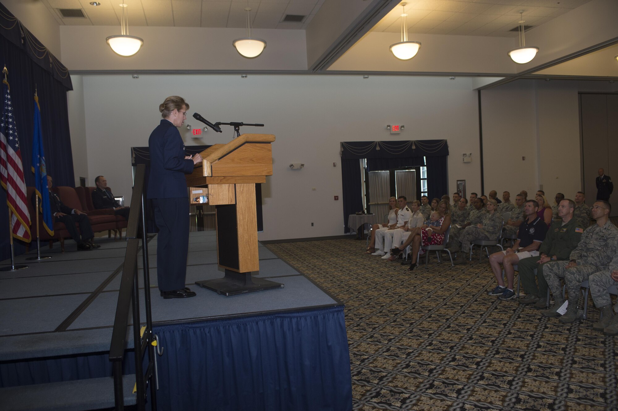 Lt. Col. Jennifer Aquinas, outgoing commander of the 512th Security Forces Squadron, gives her farewell speech before relinquishing command of the 512th SFS to Major Alexander Logan Aug. 6, 2016 at Dover Air Force Base, Del. Aquinas relinquished command to Maj. Alexander Logan, as she retires from her Air Force career. (U.S. Air Force Photo/ Tech. Sgt. Nathan Rivard)