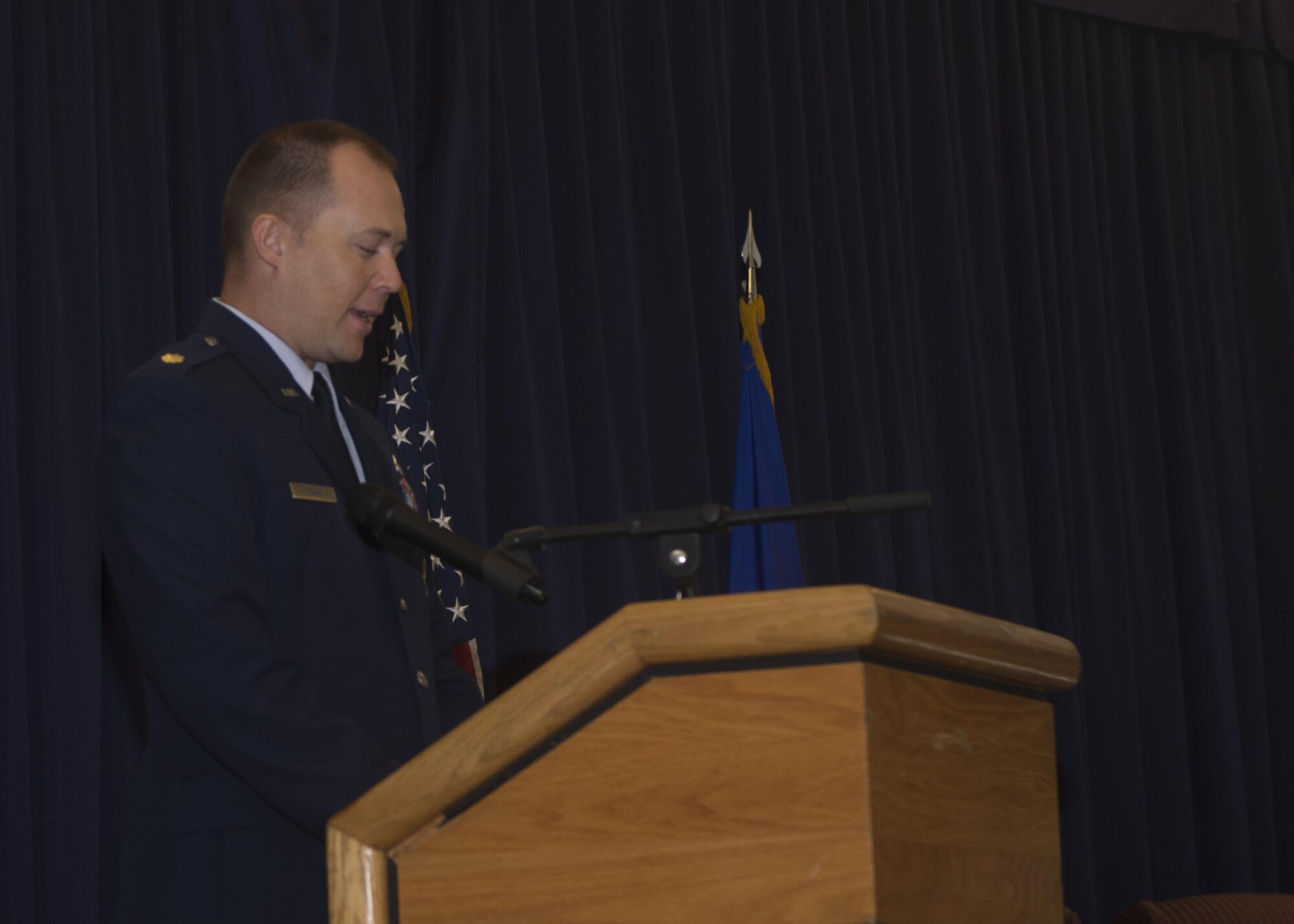 Maj. Alexander Logan, incoming 512th Security Forces Squadron commander, gives his first remarks as commander during the change of commander ceremony Aug. 6, 2016, Dover Air Force Base, Del. Logan is receiving command from outgoing commander Lt. Col. Jennifer Aquinas. (U.S. Air Force Photo/ Tech. Sgt. Nathan Rivard)