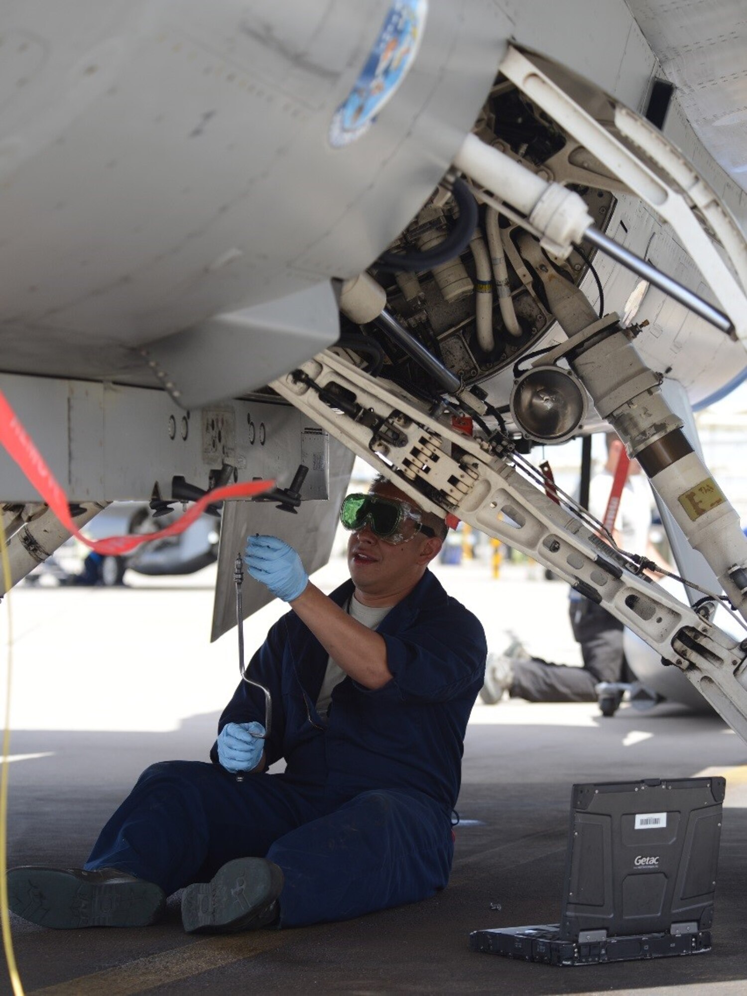 Tech. Sgt. Alejandro Mendoza Jr., 944th Detachment 1 tactical aircraft maintenance craftsman, removes a 300-gallon centerline external fuel tank on a Luke F-16 for a next mission aircraft configuration requirement at Luke Air Force Base, Ariz. (U.S. Air Force photo by Staff Sgt. Denise Willhite)
