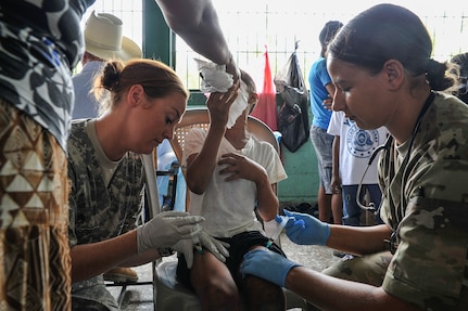U.S. Army Staff Sgt. Melissa Glaser, Joint Task Force-Bravo Medical Element medic, and 1st Lt. Jenniffer Rodriguez, JTF-Bravo MEDEL medical surgical nurse, administer antibiotics to a young boy during a Medical Readiness Training Exercise operation in Trujillo, Honduras, July 29, 2016. U.S. military personnel from JTF-Bravo have been conducting MEDRETEs since 1993 and have treated more than 326,000 medical patients. (U.S. Air Force photo by Staff Sgt. Siuta B. Ika)