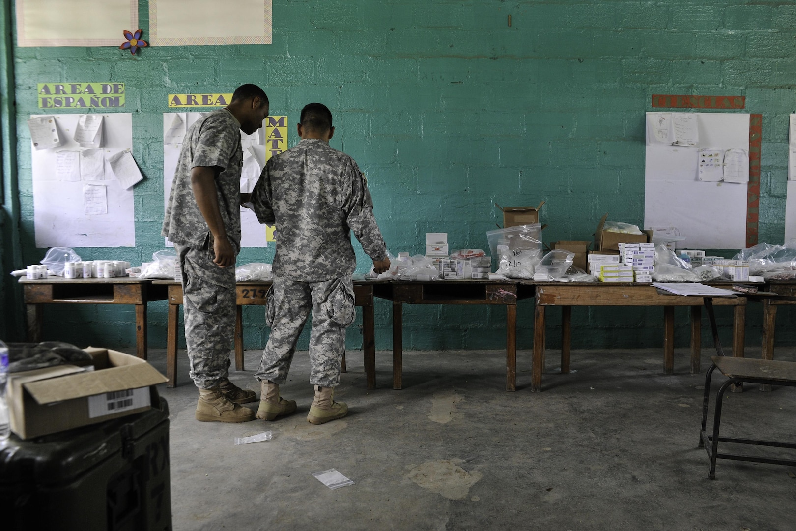 U.S. Army Spc. Joshua Miller, Joint Task Force-Bravo Medical Element medical logistics specialist, and Sgt. Jeffry Gomez, JTF-Bravo MEDEL dental technician, fulfill prescription orders during a Medical Readiness Training Exercise operation in Trujillo, Honduras, July 29, 2016. During MEDRETEs, personnel from every section of MEDEL come together to help accomplish the mission of delivering medical care in austere conditions, promoting diplomatic relations between the U.S. and host nations in Central America, and providing humanitarian and civic assistance via a long-term proactive program. (U.S. Air Force photo by Staff Sgt. Siuta B. Ika)