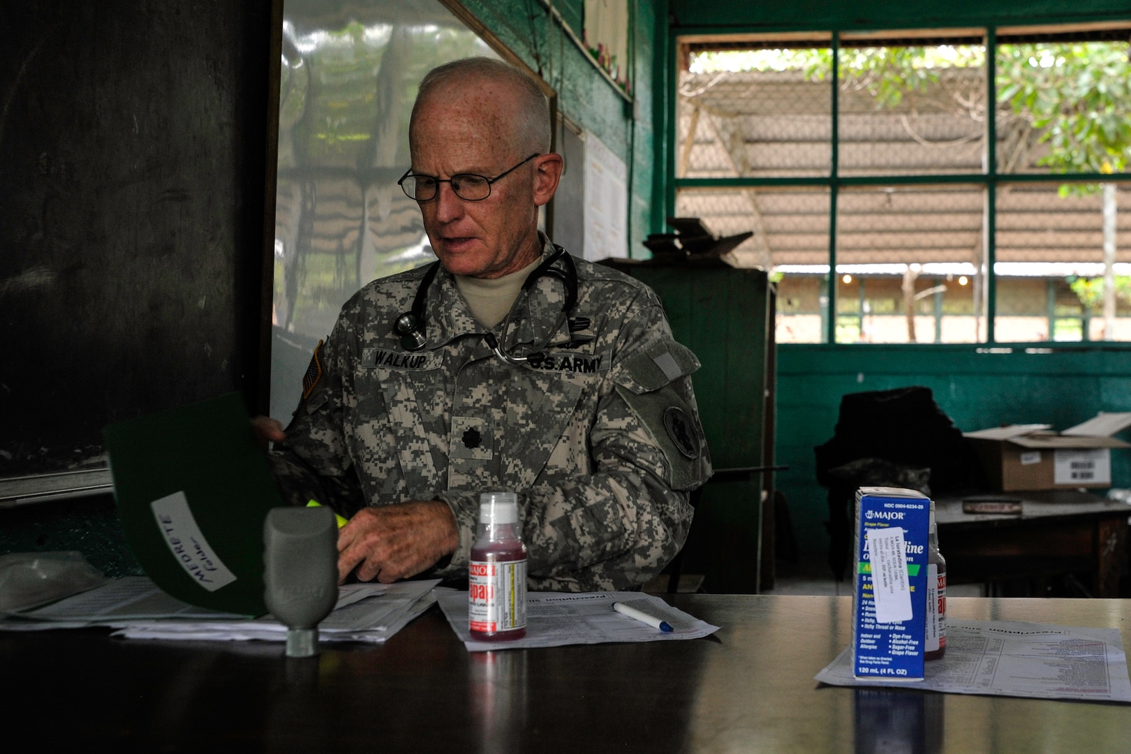 U.S. Army Lt. Col. (Dr.) Robert Walkup, Joint Task Force-Bravo Medical Element healthcare provider, reviews medication administration forms during a Medical Readiness Training Exercise operation in Trujillo, Honduras, July 29, 2016. During MEDRETEs, personnel from every section of MEDEL come together to help accomplish the mission of delivering medical care in austere conditions, promoting diplomatic relations between the U.S. and host nations in Central America, and providing humanitarian and civic assistance via a long-term proactive program. (U.S. Air Force photo by Staff Sgt. Siuta B. Ika)