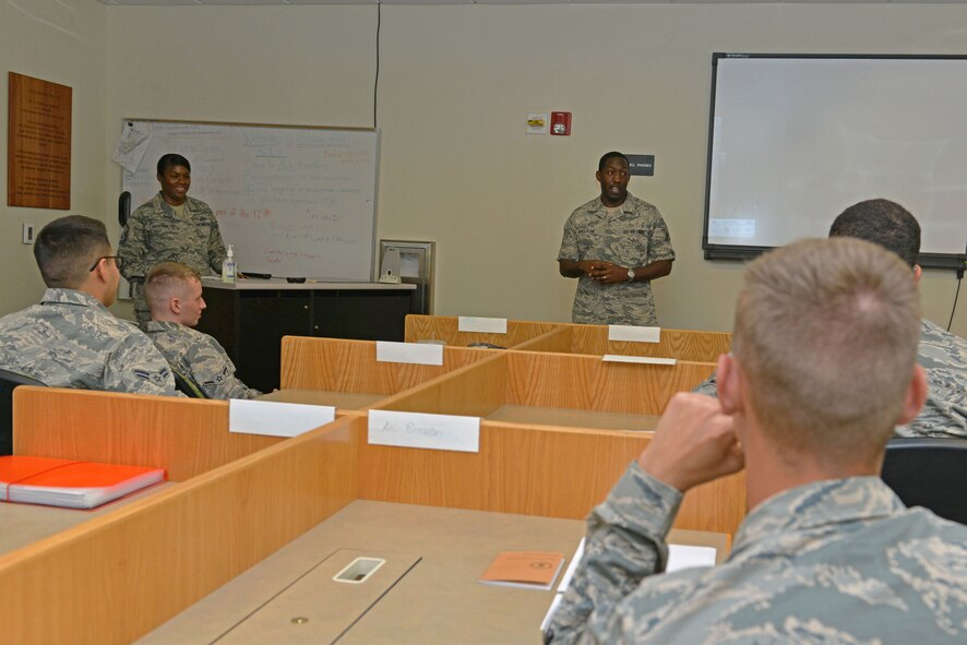 U.S. Air Force Master Sgt. Carlos Sullivan, 20th Force Support Squadron career assistant advisor, speaks to Airmen during a First Term Airman’s Course at Shaw Air Force Base, S.C., Aug. 8, 2016. During the course, Airmen receive various briefings to help them transition from a school-setting into life at their first base. (U.S. Air Force photo by Airman 1st Class Destinee Dougherty)