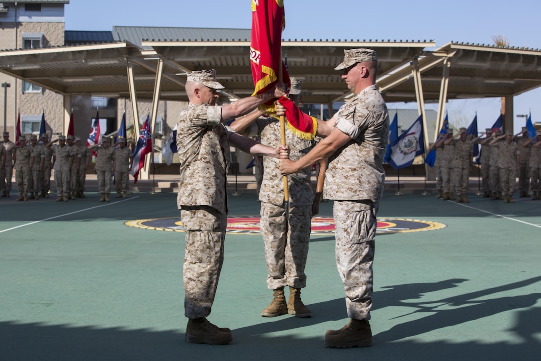 Marines with the Marine Corps Tactics and Operations Group bow their heads during the invocation as part of the unit’s change of command ceremony at the Dunham Amphitheater aboard Marine Corps Air Ground Combat Center, Twentynine Palms, Calif., July 29, 2016. During the ceremony, Col. Craig Wonson, outgoing commanding officer, relinquished command to Col. Tim Barrick, oncoming commanding officer. (Official Marine Corps photo by Cpl. Thomas Mudd/Released)