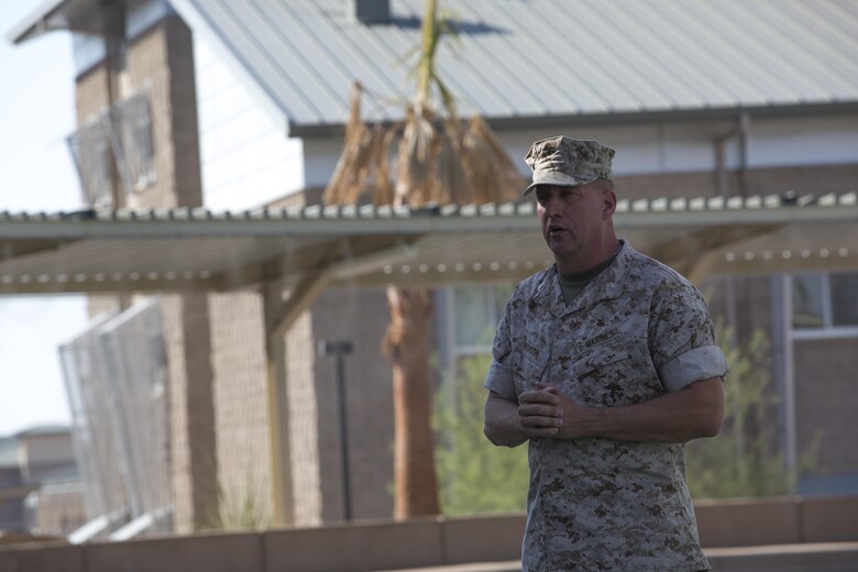 Marines with the Marine Corps Tactics and Operations Group bow their heads during the invocation as part of the unit’s change of command ceremony at the Dunham Amphitheater aboard Marine Corps Air Ground Combat Center, Twentynine Palms, Calif., July 29, 2016. During the ceremony, Col. Craig Wonson, outgoing commanding officer, relinquished command to Col. Tim Barrick, oncoming commanding officer. (Official Marine Corps photo by Cpl. Thomas Mudd/Released)