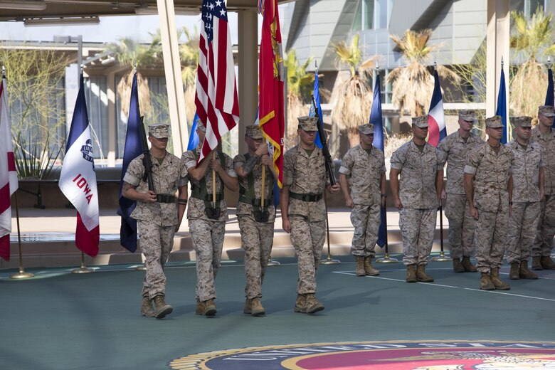 Marines with the Marine Corps Tactics and Operations Group bow their heads during the invocation as part of the unit’s change of command ceremony at the Dunham Amphitheater aboard Marine Corps Air Ground Combat Center, Twentynine Palms, Calif., July 29, 2016. During the ceremony, Col. Craig Wonson, outgoing commanding officer, relinquished command to Col. Tim Barrick, oncoming commanding officer. (Official Marine Corps photo by Cpl. Thomas Mudd/Released)
