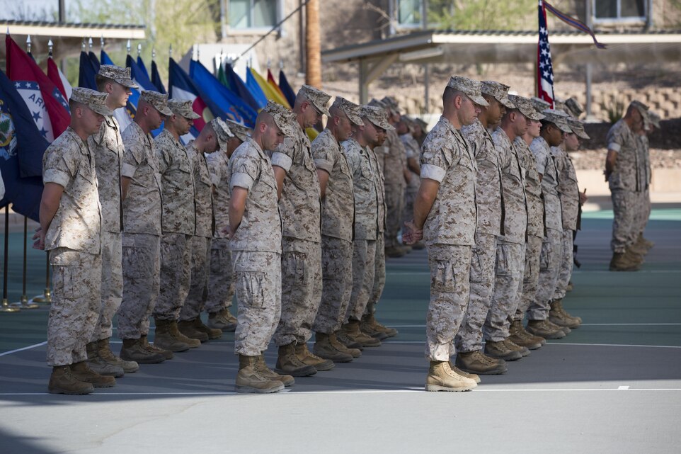 Marines with the Marine Corps Tactics and Operations Group bow their heads during the invocation as part of the unit’s change of command ceremony at the Dunham Amphitheater aboard Marine Corps Air Ground Combat Center, Twentynine Palms, Calif., July 29, 2016. During the ceremony, Col. Craig Wonson, outgoing commanding officer, relinquished command to Col. Tim Barrick, oncoming commanding officer. (Official Marine Corps photo by Cpl. Thomas Mudd/Released)