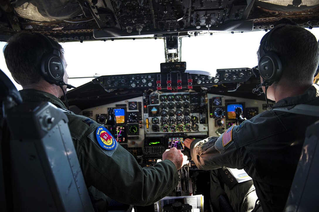 Air Force Capt. Caset Shotwell, left, and 1st Lt Everett Dotson prepare to land a KC-135 Stratotanker during exercise Red Flag 16-3 over Nellis Air Force Base, Nev., July 27, 2016. Shotwell is a pilot and Dotson is a co-pilot. Air Force photo by Tech. Sgt. David Salanitri