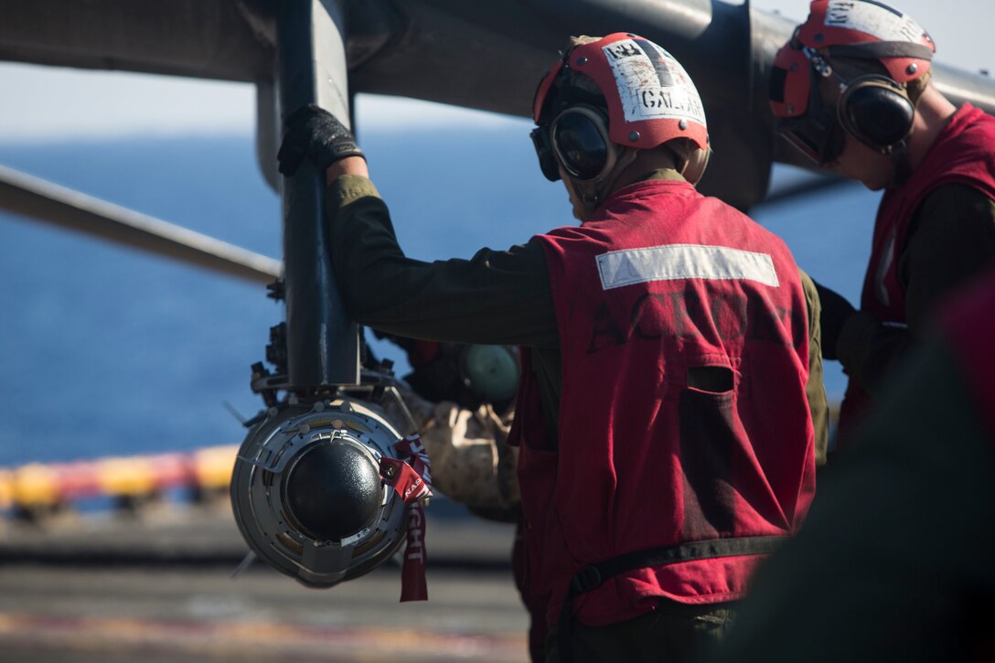 Marines from the 22nd Marine Expeditionary Unit (MEU), prepare an AV-8B Harrier II for launch on the flight deck of the amphibious assault ship USS Wasp (LHD 1) Aug. 1, 2016. The 22nd MEU is conducting precision air strikes in support of the Libyan Government of National Accord-aligned forces against Daesh targets in Sirte, Libya as part of Operation Odyssey Lightning.
