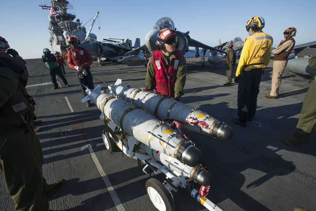 Marines with 22nd Marine Expeditionary Unit (MEU), prepare an AV-8B Harrier II for launch on the flight deck of the amphibious assault ship USS Wasp (LHD 1) Aug. 1, 2016. 22nd MEU, embarked on the Wasp is conducting precision air strikes in support of the Libyan Government of National Accord-aligned forces against Daesh targets in Sirte, Libya as part of Operation Odyssey Lightning.