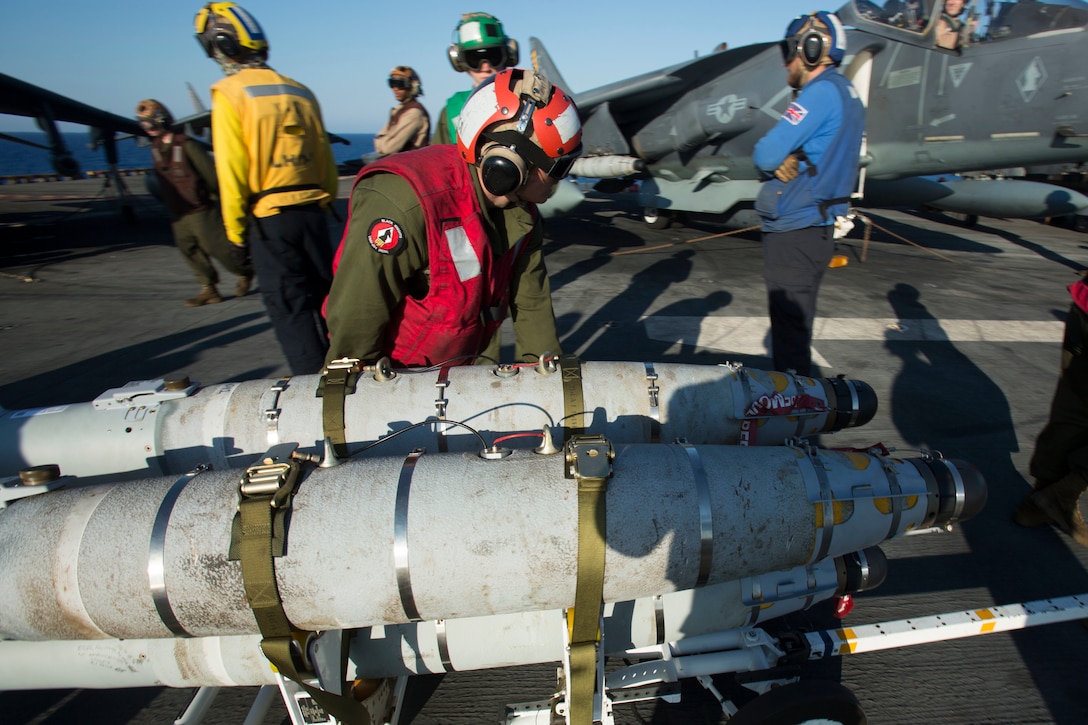 Marines with 22nd Marine Expeditionary Unit (MEU), prepare an AV-8B Harrier II for launch on the flight deck of the amphibious assault ship USS Wasp (LHD 1) Aug. 1, 2016. 22nd MEU, embarked on the Wasp is conducting precision air strikes in support of the Libyan Government of National Accord-aligned forces against Daesh targets in Sirte, Libya as part of Operation Odyssey Lightning.