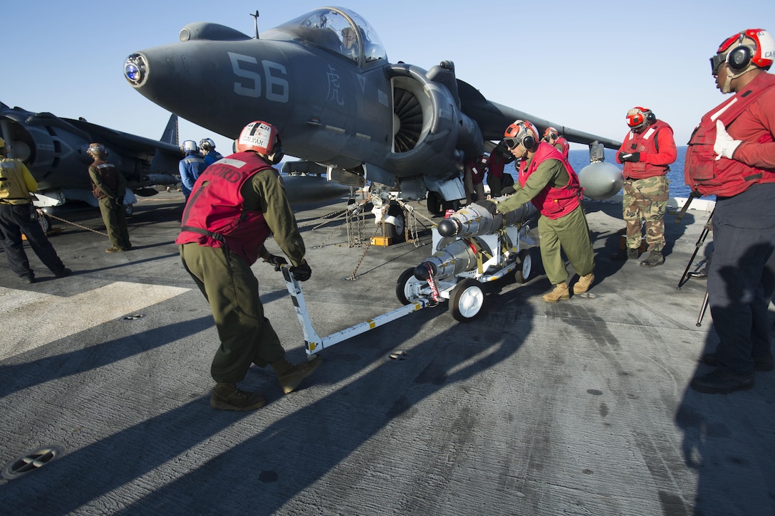 Marines with 22nd Marine Expeditionary Unit (MEU), prepare an AV-8B Harrier II for launch on the flight deck of the amphibious assault ship USS Wasp (LHD 1) Aug. 1, 2016. 22nd MEU, embarked on the Wasp is conducting precision air strikes in support of the Libyan Government of National Accord-aligned forces against Daesh targets in Sirte, Libya as part of Operation Odyssey Lightning.