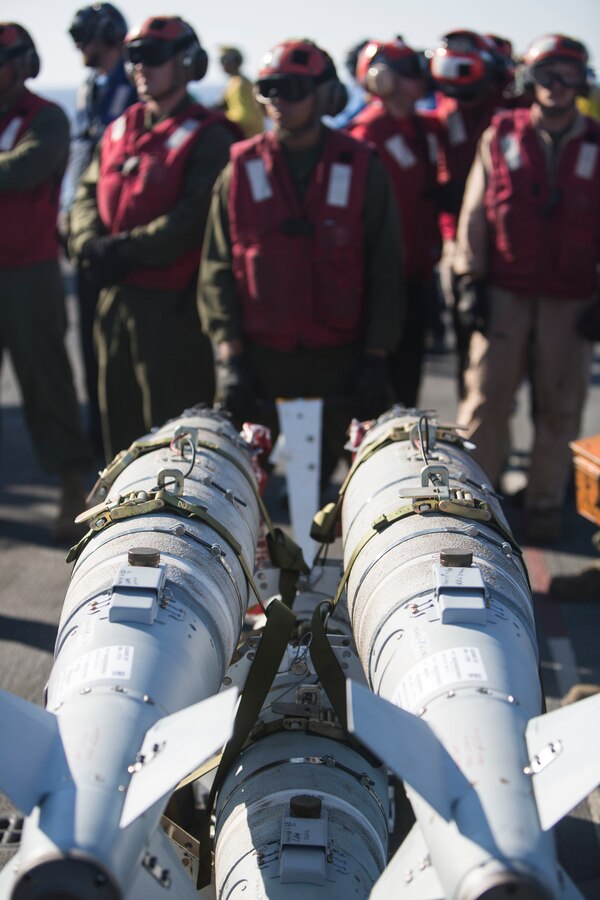 Marines with 22nd Marine Expeditionary Unit (MEU), prepare an AV-8B Harrier II for launch on the flight deck of the amphibious assault ship USS Wasp (LHD 1) Aug. 1, 2016. 22nd MEU, embarked on the Wasp is conducting precision air strikes in support of the Libyan Government of National Accord-aligned forces against Daesh targets in Sirte, Libya as part of Operation Odyssey Lightning.