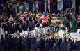 Twenty-two time Olympic medalist swimmer Michael Phelps carries the Stars and Stripes while leading Team USA into Maracanã Stadium during the Opening Ceremony of the 2016 Olympic Games in Rio de Janeiro, Brazil, August 5, 2016. (U.S. Army photo by Tim Hipps) (Photo Credit: Tim Hipps, IMCOM Public Affairs)