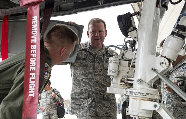 U.S. Air Force Col. Michael Schultz, 476th Fighter Group commander, discusses landing gear on the A-10C Thunderbolt II with Maj. Gen. Richard Scobee, 10th Air Force commander, Aug. 6, 2016, at Moody Air Force Base, Ga. Scobee visited Moody and talked with Airmen and leadership alike about the importance of taking care of one another. (U.S. Air Force photo by Airman 1st Class Janiqua P. Robinson)