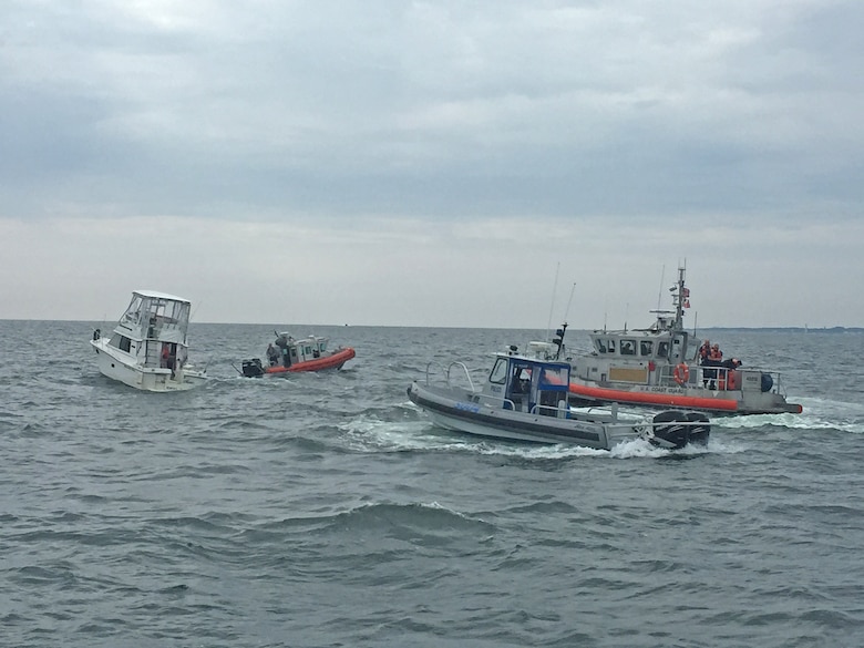 U.S. Coast Guard and other emergency vessels assist a small vessel in distress on the Chesapeake Bay after receiving the exact location of the distressed vessel from U.S. Army Corps of Engineers, Baltimore District's Survey Vessel LINTHICUM Sunday Aug. 7, 2016. LINTHICUM responded after being notified by a passing ship of a nearby flare while conducting a condition survey of the nearby Cape Henry Channel.