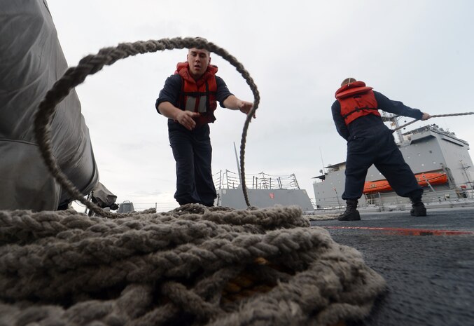 Gunner's Mate 2nd Class James Callison coils line aboard the guided-missile destroyer USS Momsen (DDG 92) during a replenishment-at-sea with the fleet replenishment oiler USNS Joshua Humphreys (T-AO 188), Aug. 8, 2016. The guided-missile destroyers USS Spruance (DDG 111), USS Decatur (DDG 73- and Momsen are deployed in support of maritime security and stability in the Indo-Asia Pacific as part of a U.S. 3rd Fleet Pacific Surface Action Group (PAC SAG) under Commander, Destroyer Squadron (CDS) 31.