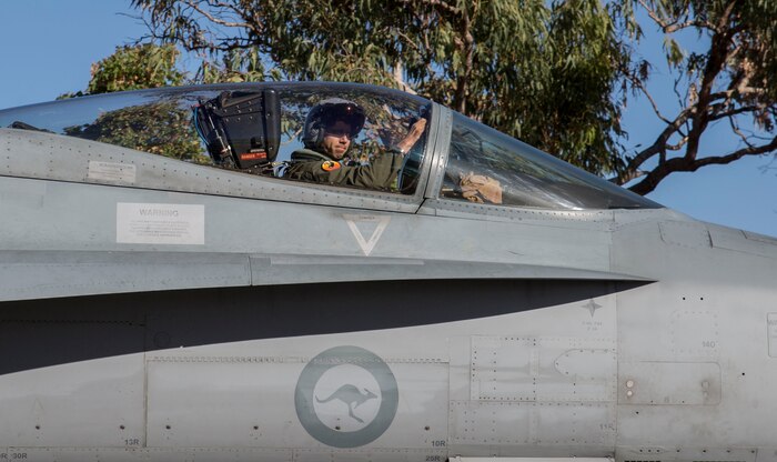 U.S. Marine Corps Maj. Alexander Goodno, Marine exchange pilot with the Royal Australian Air Force No. 75 Squadron, taxis to the runway in an F/A-18 Hornet during Exercise Pitch Black 2016 at RAAF Base Tindal, Australia, Aug. 5, 2016. Goodno has been stationed with No. 75 Squadron for two and a half years with the Marine Corps Foreign Personnel Exchange Program. This program enhances worldwide security cooperation by continuing long-term presence and association among military counterparts. During Pitch Black, Goodno serves as a liaison officer to the participating U.S. units, explaining foreign jargon and procedures. (U.S. Marine Corps photo by Cpl. Nicole Zurbrugg)