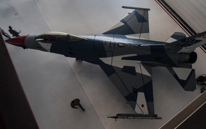 The 64th Aggressor Squadron, Nellis Air Force Base, Nev., debut the new paint scheme for the F-16 Aggressors during the 57th Adversary Tactics Group change of command ceremony Aug. 5, 2016. Since 1972, the 64th Aggressor Squadron has prepared combat air forces by providing realistic threat replication and training. (U.S. Air Force photo by Airman 1st Class Kevin Tanenbaum/Released)