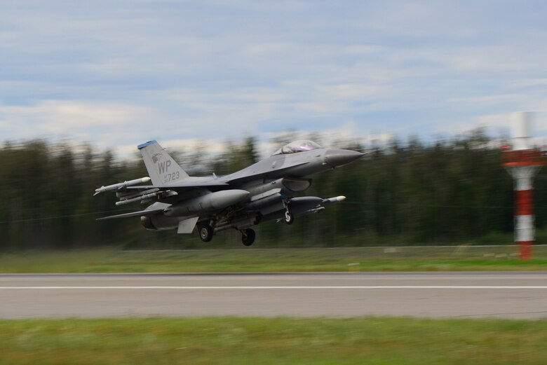 A U.S. Air Force F-16 Fighting Falcon aircraft assigned to the 35th Fighter Squadron, Kunsan Air Base, Republic of Korea, launches from the Eielson Air Force Base, Alaska flight line in preparation for a morning sortie Aug. 8, 2016, during RED FLAG-Alaska 16-3. Exercise scenarios occur within the Joint Pacific Alaska Range Complex, a more than 67,000 square mile airspace with minimal impact on the environment. (U.S. Air Force photo by Airman 1st Class Cassandra Whitman)