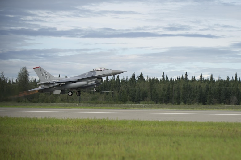 A U.S. Air Force F-16 Fighting Falcon aircraft assigned to the 13th Fighter Squadron, Misawa Air Base, Japan, launches from Eielson Air Force Base, Alaska, for a morning sortie Aug., 8, 2016, during RED FLAG-Alaska 16-3. Conducting RED FLAG training in Alaska signifies the United States’ continued commitment to the Indo-Asia-Pacific region. (U.S. Air Force photo by Airman Isaac Johnson)