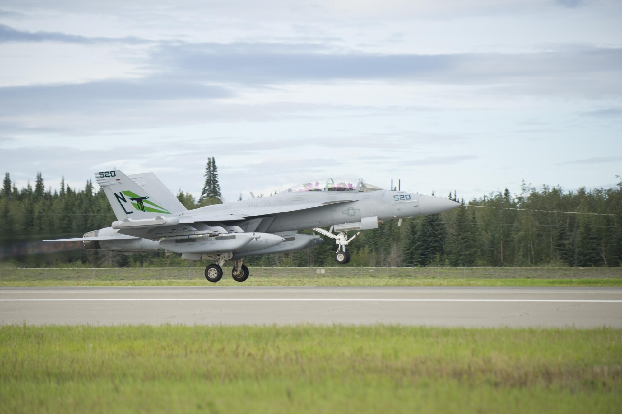 A U.S. Navy EA-18G Growler aircraft assigned to Electronic Attack Squadron 135, Naval Air Station Whidbey Island, Wash., takes off from Eielson Air Force Base, Alaska, for a morning sortie Aug., 8, 2016, during RED FLAG-Alaska 16-3. This exercise provides unique opportunities to integrate various forces into joint, coalition and multilateral training from simulated forward operating bases. (U.S. Air Force photo by Airman Isaac Johnson)