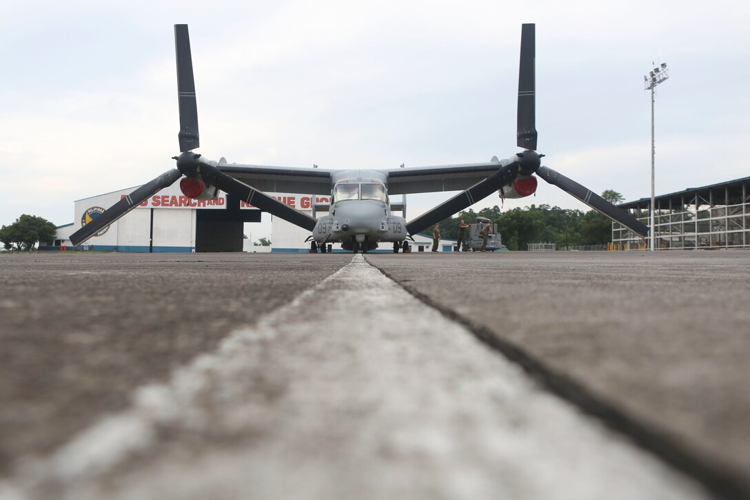 CLARK AIR BASE, Philippines — U.S. Marines assigned to Marine Medium Tiltrotor Squadron 265, Marine Aircraft Group 36, 1st Marine Aircraft Wing, III Marine Expeditionary Force, work on a MV-22B Osprey at Clark Air Base in the Philippines in preparation for Air Assault Support Exercise 16.2, July 30, 2016. The goal of AASE 16.2 is to maintain the readiness and interoperability of the U.S. and armed forces of the Philippines to ensure an effective and rapid response to any contingency in the region. (Marine Corps Photo by Lance Cpl. Carl King/Released)