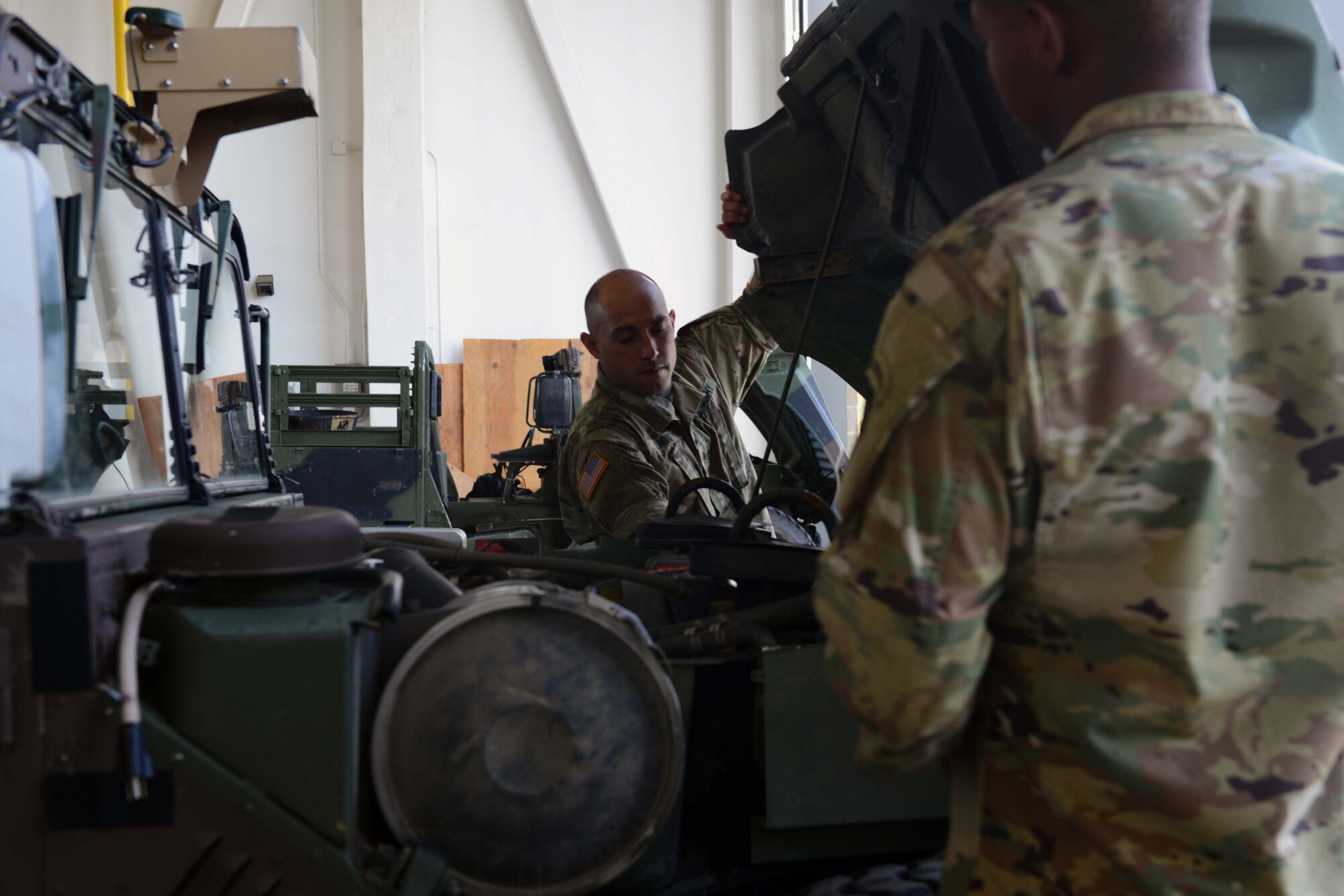 Army Sgt. Michael Labre, A Battery, 2nd Battalion, 377th Parachute Field Artillery Regiment ammunition team chief, lifts the hood of a High Mobility Multipurpose Wheeled Vehicle at Joint Base Elmendorf-Richardson, Alaska, August 3, 2016. The HMMWV’s mission is to provide a common light tactical vehicle capability. It replaced the quarter-ton jeep, M718A1 ambulance, half-ton Mule, 1.25-ton Gamma Goat, and M792 ambulance. (U.S. Air Force photo by Airman 1st Class Javier Alvarez)