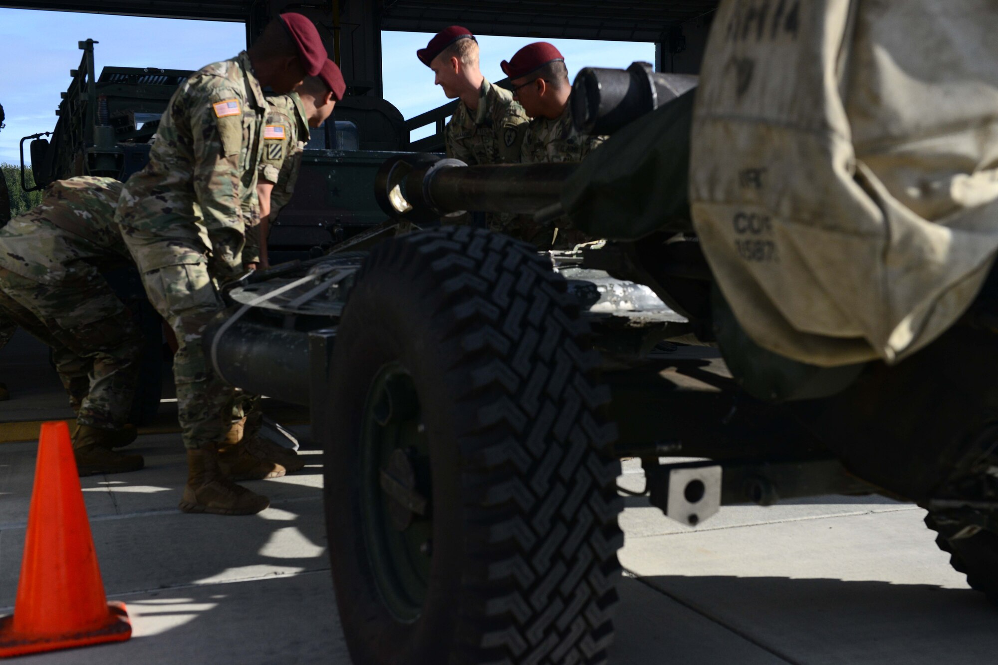 A group of U.S. Army Alaska soldiers of the 2nd Battalion, 377th Parachute Field Artillery Regiment lift an M119 Howitzer at Joint Base Elmendorf-Richardson, Alaska, August 3, 2016. The M119 was first deployed in the 7th Infantry Division, Fort Ord in December 1989. (U.S. Air Force photo by Airman 1st Class Javier Alvarez)