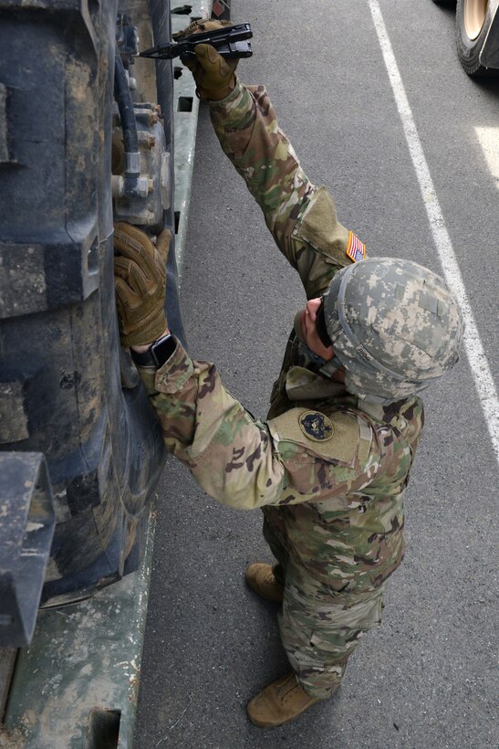 A U.S. Army Soldier with the 539th Composite Truck Company from Fort Wainwright, Alaska, releases the tire pressure on a Heavy Mobility Tactical Truck at Joint Base Elmendorf-Richardson, Alaska, August 3, 2016. The equipment transported will be used by multiple USARAK Soldiers for a live-fire training exercise at the Denali Training Area. The purpose of the live-fire is to ensure proficiency, increase capabilities, as well as to ensure certification in support of future operations. (U.S Air Force photo by Airman 1st Class Javier Alvarez)
