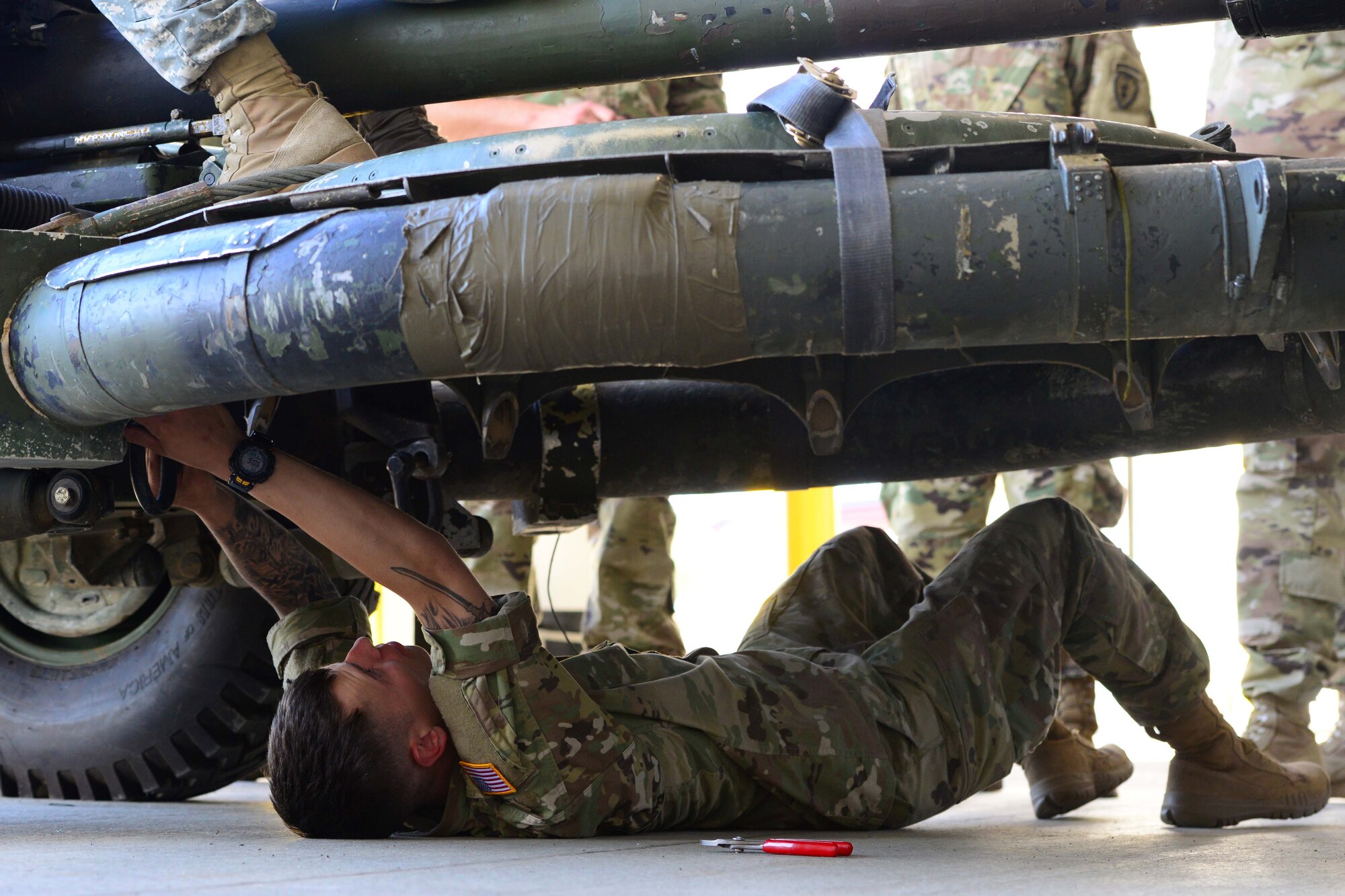 A U.S. Army Alaska Soldier of the 2nd Battalion, 377th Parachute Field Artillery Regiment ensures the cleanliness and serviceability of a M119 Howitzer at Joint Base Elmendorf-Richardson, Alaska, August 3, 2016. Soldiers documented the weight and dimensions, and ensured the cleanliness and serviceability of items shipped to Joint Base Lewis-McChord in support of JBLM’s 75th Ranger Battalion. The 773d Logistics Readiness Squadron Deployment Flight certified rolling stock and containers for sea shipment. The shipment was an interagency collaboration between JBER, Surface Deployment and Distribution Command, and the Port of Anchorage. (U.S. Air Force photo by Airman 1st Class Javier Alvarez)