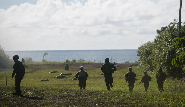 U.S. Marine infantrymen, combat engineers and Tongan soldiers sprint toward an obstacle to prepare a demolition charge to clear a path, July 27, 2016, on Motutapu Island, Tonga, as part of a multi-national, bilateral exercise designed to increase interoperability and relations. The service members combined skills practiced during the exercise into a culminating range such as beach insertion, buddy rushing, demolition and high explosive exploitation. The infantrymen and engineers are with Task Force Koa Moana. The infantrymen are originally assigned to 1st Battalion, 1st Marine Regiment, 1st Marine Division, I Marine Expeditionary Force. The engineers are originally assigned to 9th Engineer Support Battalion, 3rd Marine Logistics Group, III Marine Expeditionary Force. (U.S. Marine Corps photo by Cpl. William Hester/ Released)
