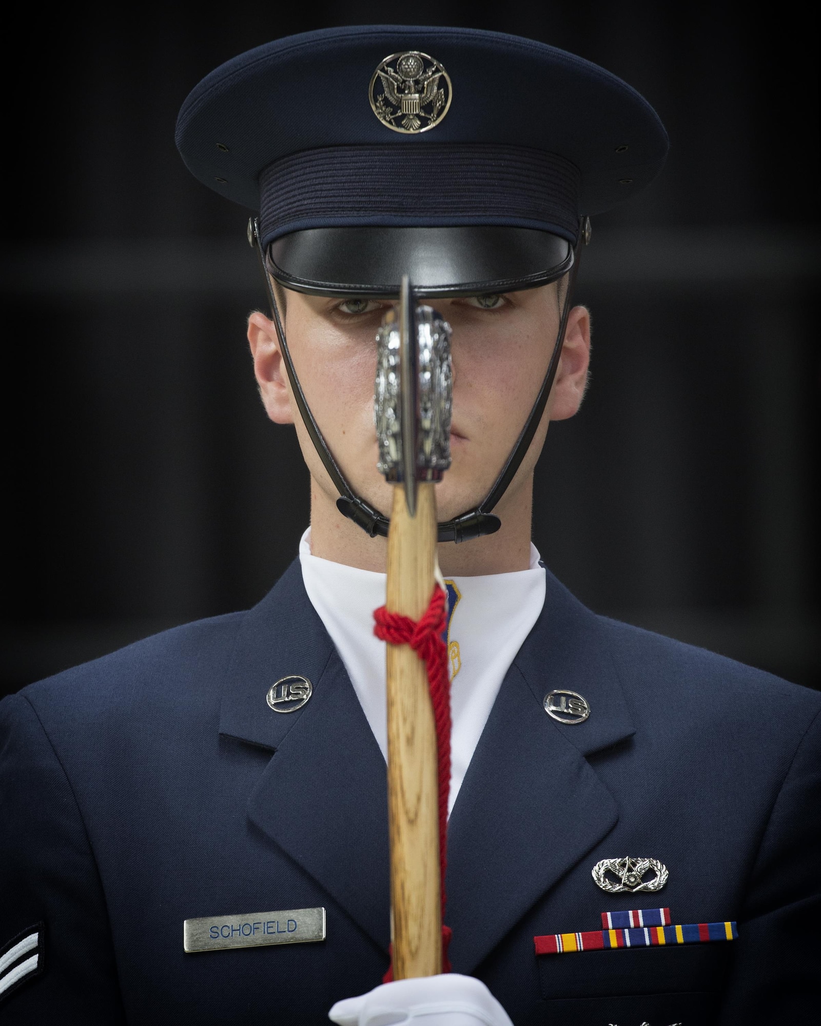 Airman 1st Class Zachary Schofield, Yokota honor guardsman, holds a ceremonial axe representing the 374th Mission Support Group, under the command of Col. Scott Maskery, during the 374 MSG change of command ceremony at Yokota Air Base, Japan, Aug. 8, 2016. Masa-kari, or axe in Japanese, is the nickname local community leaders gave to Maskery, because its similarity to the colonel’s last name. (U.S. Air Force photo by Yasuo Osakabe) 