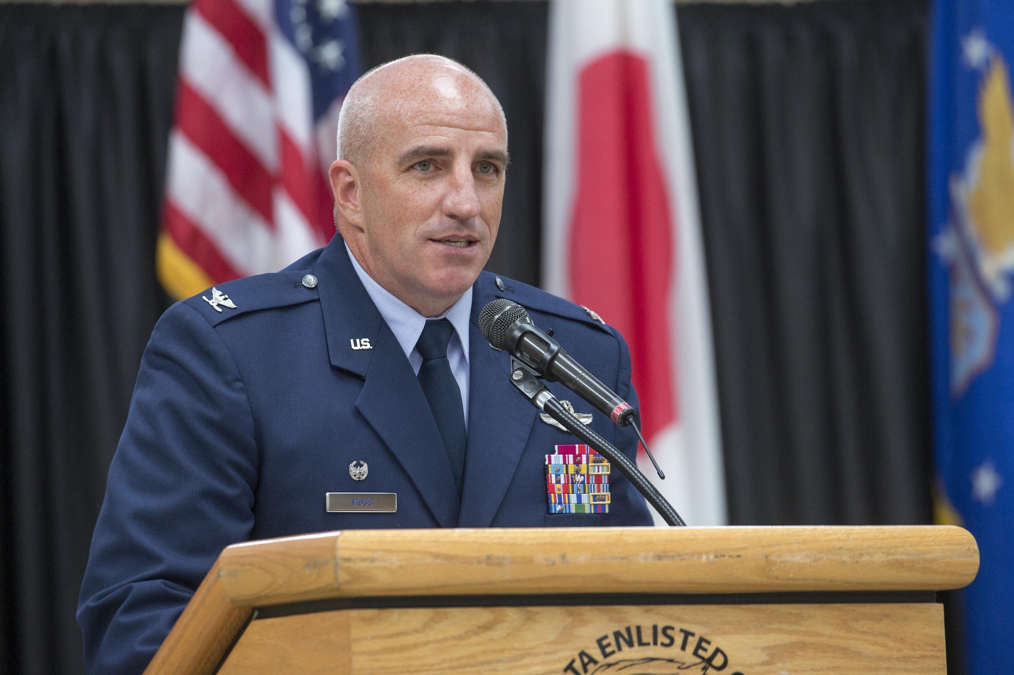 Col. Kenneth Moss, 374th Airlift Wing commander, gives remarks during the 374th Mission Support Group change of command ceremony at Yokota Air Base, Japan, Aug. 8, 2016. Moss spoke about the challenges the 374 MSG faced such as new facilities and natural disasters and mentioned the awards the group won for its efforts. (U.S. Air Force photo by Yasuo Osakabe/Released)