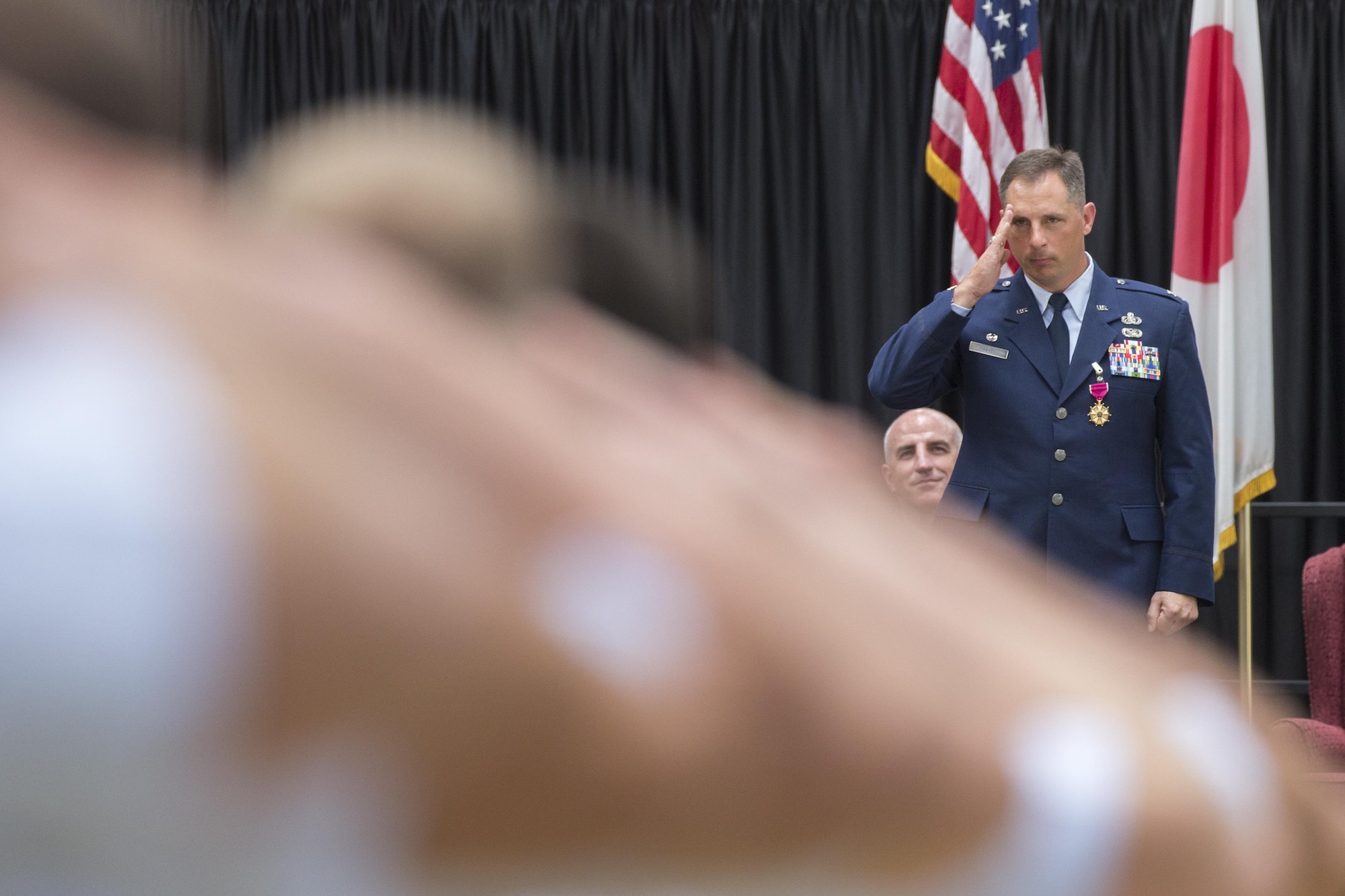 Col. Scott Maskery, 374th Mission Support Group commander, renders his final salute as commander during a change of command ceremony at Yokota Air Base, Japan, Aug. 8, 2016. (U.S. Air Force photo by Yasuo Osakabe/Released)