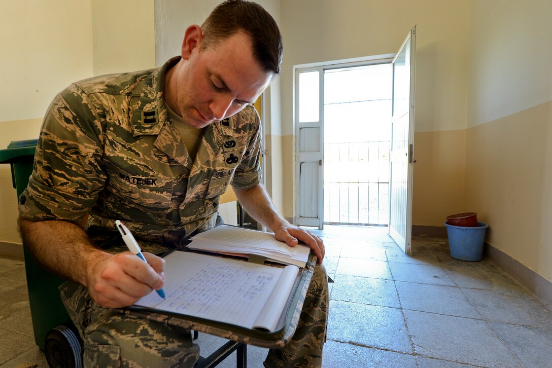 U.S. Air Force Capt. Andrew Matejek, New Jersey Air National Guard civil engineer, goes over a material list for Humanitarian and Civic Assistance renovation projects to be completed during the unit's Deployment For Training to Vau i Dejës, Albania on July 6, 2016. The 177th Fighter Wing civil engineers’ planned projects include plumbing, electrical, ceramic tile, roofing, and door and frame maintenance and installations at a local medical clinic and a school in the nearby municipality of Mjede. New Jersey and Albania are paired under the National Guard's State Partnership Program and are a proven partnership built upon shared values, experiences and vision. (U.S. Air National Guard photo by Master Sgt. Andrew J. Moseley/Released)